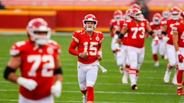Patrick Mahomes #15 of the Kansas City Chiefs runs onto the field (Photo by David Eulitt/Getty Images)