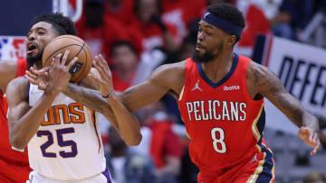 Mikal Bridges #25 of the Phoenix Suns is fouled by Naji Marshall #8 of the New Orleans Pelicans (Photo by Jonathan Bachman/Getty Images)