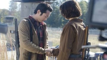 Glenn (Steven Yeun) and Maggie Greene (Lauren Cohan) - The Walking Dead_Season 3, Episode 15_"This Sorrowful Life" - Photo Credit: Gene Page/AMC