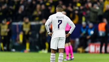 DORTMUND, GERMANY - FEBRUARY 18: Kylian Mbappe of Paris Saint Germain stands at the field while Dortmund celebrates a goal during the UEFA Champions League round of 16 first leg match between Borussia Dortmund and Paris Saint-Germain at Signal Iduna Park on February 18, 2020 in Dortmund, Germany. (Photo by Eurasia Sport Images/Getty Images)