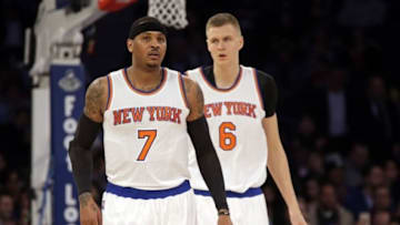 Feb 2, 2016; New York, NY, USA; New York Knicks forward Carmelo Anthony (7) and forward Kristaps Porzingis (6) against the Boston Celtics during the first half of an NBA basketball game at Madison Square Garden. Mandatory Credit: Adam Hunger-USA TODAY Sports