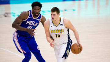 PHILADELPHIA, PA - MARCH 26: Denver Nuggets Center Nikola Jokic (15) carries the ball guarded by Philadelphia 76ers Center Joel Embiid (21) in the second half during the game between the Denver Nuggets and Philadelphia 76ers on March 26, 2018 at Wells Fargo Center in Philadelphia, PA. (Photo by Kyle Ross/Icon Sportswire via Getty Images)