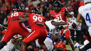Cincinnati Bearcats defend Tulsa Golden Hurricane at Nippert Stadium. The Enquirer.