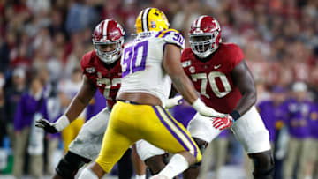 Alex Leatherwood #70 of the Alabama Crimson Tide looks to block Rashard Lawrence #90 of the LSU Tigers during the second half at Bryant-Denny Stadium on November 9, 2019 in Tuscaloosa, Alabama. (Photo by Todd Kirkland/Getty Images)