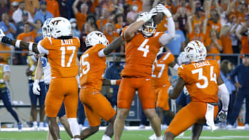 Sep 3, 2021; Blacksburg, Virginia, USA; Virginia Tech Hokies linebacker Dax Hollifield (4) intercepts a pass as linebacker Alan Tisdale (34) and safety Tae Daley (17) and linebacker Keshon Artis (15) assist during the second half against the North Carolina Tar Heels at Lane Stadium. Mandatory Credit: Reinhold Matay-USA TODAY Sports