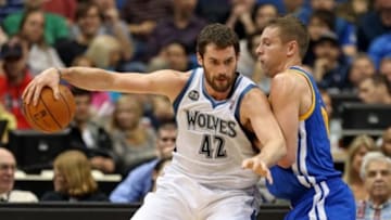 Nov 6, 2013; Minneapolis, MN, USA; Golden State Warriors power forward David Lee (10) plays tight defense on Minnesota Timberwolves power forward Kevin Love (42) as he attempts to drive to the basket in the first half at Target Center. Mandatory Credit: Jesse Johnson-USA TODAY Sports