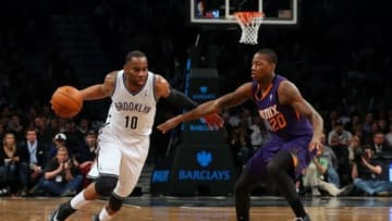 Mar 17, 2014; Brooklyn, NY, USA; Brooklyn Nets guard Marcus Thornton (10) drives around Phoenix Suns guard Archie Goodwin (20) during the fourth quarter at Barclays Center. Brooklyn Nets won 108-95. Mandatory Credit: Anthony Gruppuso-USA TODAY Sports