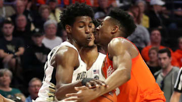 WINSTON-SALEM, NORTH CAROLINA - MARCH 02: Jaylen Hoard #10 of the Wake Forest Demon Deacons goes after a loose ball against Tyus Battle #25 of the Syracuse Orange during their game at LJVM Coliseum Complex on March 02, 2019 in Winston-Salem, North Carolina. (Photo by Streeter Lecka/Getty Images)