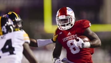 Nov 7, 2015; Bloomington, IN, USA; Indiana Hoosiers running back Jordan Howard (8) attempts to evade a tackle during the second half of the game at Memorial Stadium. The Hawkeyes defeated the Hoosiers 35-27. Mandatory Credit: Marc Lebryk-USA TODAY Sports