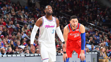 PHILADELPHIA,PA - FEBRUARY 14 : Ben Simmons #25 of the Philadelphia 76ers stands next to Dwyane Wade #3 of he Miami Heat at Wells Fargo Center on February 14, 2018 in Philadelphia, Pennsylvania NOTE TO USER: User expressly acknowledges and agrees that, by downloading and/or using this Photograph, user is consenting to the terms and conditions of the Getty Images License Agreement. Mandatory Copyright Notice: Copyright 2018 NBAE (Photo by Jesse D. Garrabrant/NBAE via Getty Images)