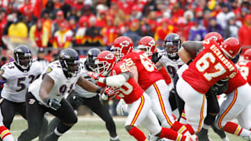 KANSAS CITY, MO - JANUARY 9: Brandon McKinney #91 of the Baltimore Ravens makes a tackle against Thomas Jones #20 of the Kansas City Chiefs during the AFC Wild Card playoff game at Arrowhead Stadium on January 9, 2011 in Kansas City, Missouri. The Ravens defeated the Chiefs 30-7. (Photo by Joe Robbins/Getty Images)