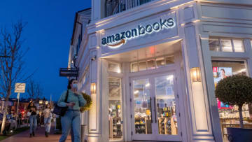 LOS ANGELES, CALIFORNIA - APRIL 24: People wearing masks walk past an Amazon Books in the Pacific Palisades amid the coronavirus pandemic on April 24, 2021 in Los Angeles, California. Los Angeles County moved into Covid-19 orange tier restrictions on April 5 allowing increased capacity at restaurants, movie theaters and museums. (Photo by Alexi Rosenfeld/Getty Images)