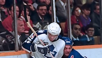 TORONTO, ON - FEBRUARY 25: Rick Vaive #22 of the Toronto Maple Leafs skates against Ron Greschner #4 of the New York Rangers during NHL game action on February 25, 1987 at Maple Leaf Gardens in Toronto, Ontario, Canada. (Photo by Graig Abel/Getty Images)