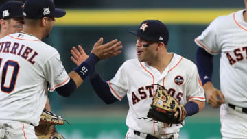 HOUSTON, TX - OCTOBER 05: Jose Altuve #27 of the Houston Astros celebrates a 8-2 win with Yuli Gurriel #10 against the Boston Red Sox during game one of the American League Division Series at Minute Maid Park on October 5, 2017 in Houston, Texas. (Photo by Ronald Martinez/Getty Images)