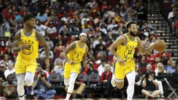 HOUSTON, TX - NOVEMBER 06: Ky Bowman #12 of the Golden State Warriors brings the ball up court in the second half against the Houston Rockets at Toyota Center on November 6, 2019 in Houston, Texas. NOTE TO USER: User expressly acknowledges and agrees that, by downloading and or using this photograph, User is consenting to the terms and conditions of the Getty Images License Agreement. (Photo by Tim Warner/Getty Images)