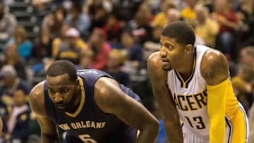 Oct 3, 2015; Indianapolis, IN, USA; Indiana Pacers forward Paul George (13) and New Orleans Pelicans center Kendrick Perkins (5) before a free throw in the second quarter the game at Bankers Life Fieldhouse. Mandatory Credit: Trevor Ruszkowski-USA TODAY Sports
