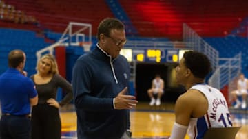 Kansas head coach Bill Self takes a moment to speak with redshirt senior guard Kevin McCullar Jr. (15) during media day interviews Tuesday inside Allen Fieldhouse.