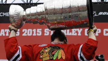 Jun 18, 2015; Chicago, IL, USA; Chicago Blackhawks defenseman Brent Seabrook (7) kisses the Stanley Cup trophy during the 2015 Stanley Cup championship rally at Soldier Field. Mandatory Credit: Matt Marton-USA TODAY Sports
