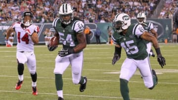 Aug 21, 2015; East Rutherford, NJ, USA; New York Jets linebacker Jamari Lattimore (54) runs with the ball after his interception during the first half of their game against the Atlanta Falcons at MetLife Stadium. Mandatory Credit: Ed Mulholland-USA TODAY Sports