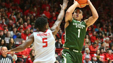 ALBUQUERQUE, NEW MEXICO - DECEMBER 28: John Tonje #1 of the Colorado State Rams shoots against Jamal Mashburn Jr. #5 of the New Mexico Lobos during the first half of their game at The Pit on December 28, 2022 in Albuquerque, New Mexico. (Photo by Sam Wasson/Getty Images)