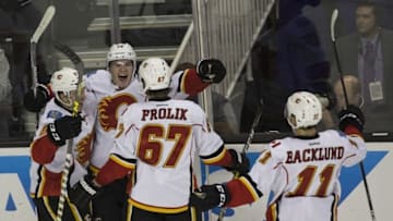 Nov 3, 2016; San Jose, CA, USA; Calgary Flames left wing Matthew Tkachuk (19) celebrates with right wing Michael Frolik (67) and center Mikael Backlund (11) after scoring a goal during the third period against the San Jose Sharks at SAP Center at San Jose the Calgary Flames defeated the San Jose Sharks 3 to 2. Mandatory Credit: Neville E. Guard-USA TODAY Sports
