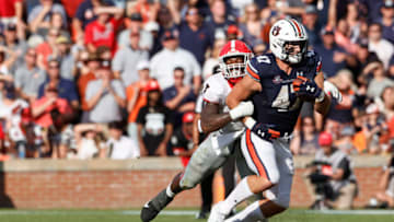 Auburn footballOct 9, 2021; Auburn, Alabama, USA; Auburn Tigers tight end John Samuel Shenker (47) is tackled by Georgia Bulldogs linebacker Quay Walker (7) during the second quarter at Jordan-Hare Stadium. Mandatory Credit: John Reed-USA TODAY Sports
