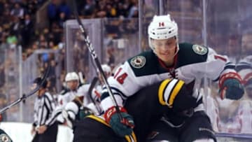 Oct 25, 2016; Boston, MA, USA; Minnesota Wild center Joel Eriksson Ek (14) tries to get past Boston Bruins defenseman Adam McQuaid (54) during the second period at TD Garden. Mandatory Credit: Winslow Townson-USA TODAY Sports