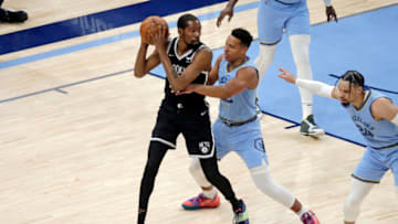 Mar 23, 2022; Memphis, Tennessee, USA; Brooklyn Nets forward Kevin Durant (7) controls the ball as Memphis Grizzlies guard Desmond Bane (22) defends during the first half at FedExForum. (Petre Thomas-USA TODAY Sports)