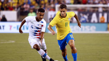 Brazil's midfileder Philippe Coutinho (R) vies for the ball against US midfileder Tyler Adams during the international friendly match between Brazil and the US at the Metlife Stadium in East Rutherford, New Jersey on September 7, 2018. (Photo by EDUARDO MUNOZ ALVAREZ / AFP) (Photo credit should read EDUARDO MUNOZ ALVAREZ/AFP/Getty Images)