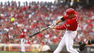 Jul 22, 2016; Cincinnati, OH, USA; Cincinnati Reds first baseman Joey Votto hits a three-run home run against the Arizona Diamondbacks during the first inning at Great American Ball Park. Mandatory Credit: David Kohl-USA TODAY Sports