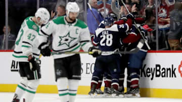 DENVER, CO - NOVEMBER 24: Mikko Rantanen #96 of the Colorado Avalanche is congratulated by his teammates after scoring what would be the winning goal against the Dallas Stars in the third period at the Pepsi Center on November 24, 2018 in Denver, Colorado. (Photo by Matthew Stockman/Getty Images)