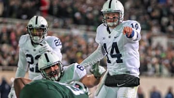 Nov 28, 2015; East Lansing, MI, USA; Penn State Nittany Lions quarterback Christian Hackenberg (14) gestures to the Michigan State Spartans defense during the second half of a game at Spartan Stadium. Mandatory Credit: Mike Carter-USA TODAY Sports