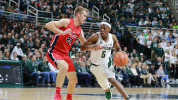 EAST LANSING, MI - NOVEMBER 19: Cassius Winston #5 of the Michigan State Spartans drives to the basket against Bryan Sekunda #22 of the Stony Brook Seawolves at Breslin Center on November 19, 2017 in East Lansing, Michigan. (Photo by Rey Del Rio/Getty Images)
