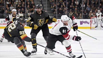 LAS VEGAS, NEVADA - NOVEMBER 29: Phil Kessel #81 of the Arizona Coyotes skates with the puck against Tomas Nosek #92 of the Vegas Golden Knights in the third period of their game at T-Mobile Arena on November 29, 2019 in Las Vegas, Nevada. The Golden Knights defeated the Coyotes 2-1 in a shootout. (Photo by Ethan Miller/Getty Images)
