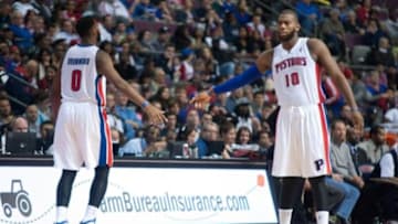 Oct 30, 2013; Auburn Hills, MI, USA; Detroit Pistons center Andre Drummond (0) high fives center Greg Monroe (10) during the fourth quarter at The Palace of Auburn Hills. Pistons won 113-102. Mandatory Credit: Tim Fuller-USA TODAY Sports