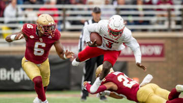 CHESTNUT HILL, MA - OCTOBER 01: Malik Cunningham #3 of the Louisville Cardinals is tackled by Cole Batson #23 of the Boston College Eagles during the second half of a game at Alumni Stadium on October 1, 2022 in Chestnut Hill, Massachusetts. (Photo by Maddie Malhotra/Getty Images)