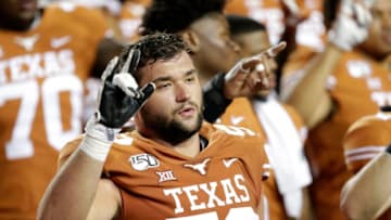 AUSTIN, TX - SEPTEMBER 21: Samuel Cosmi #52 of the Texas Longhorns celebrates with teammates after the game against the Oklahoma State Cowboys at Darrell K Royal-Texas Memorial Stadium on September 21, 2019 in Austin, Texas. (Photo by Tim Warner/Getty Images)
