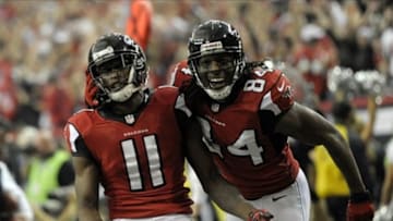 Jan 20, 2013; Atlanta, GA, USA; Atlanta Falcons wide receiver Julio Jones (11) celebrates a touchdown catch against the San Francisco 49ers with wide receiver Roddy White (84) during the second quarter of the NFC Championship game at the Georgia Dome. Mandatory Credit: Dale Zanine-USA TODAY Sports