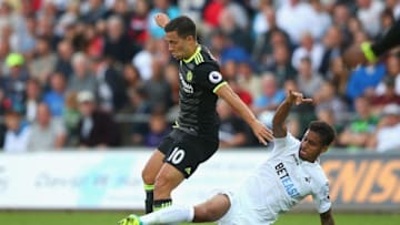 SWANSEA, WALES - SEPTEMBER 11: Eden Hazard of Chelsea is tackled by Kyle Naughton of Swansea City during the Premier League match between Swansea City and Chelsea at Liberty Stadium on September 11, 2016 in Swansea, Wales. (Photo by Alex Livesey/Getty Images)