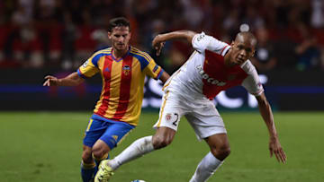 MONACO - AUGUST 25: Fabinho (R) of Monaco in action against Pablo Piatti of Valencia during the UEFA Champions League qualifying round play off second leg match between Monaco and Valencia on August 25, 2015 in Monaco, Monaco. (Photo by Valerio Pennicino/Getty Images)