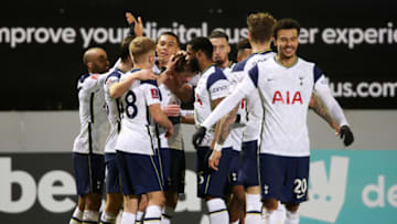 CROSBY, ENGLAND - JANUARY 10: Alfie Devine of Tottenham Hotspur celebrates with teammates Lucas Moura, Ben Davies, Harvey White, Carlos Vinicius, Japhet Tanganga and Matt Doherty after scoring their team's fifth goal during the FA Cup Third Round match between Marine and Tottenham Hotspur at Rossett Park on January 10, 2021 in Crosby, England. Sporting stadiums around England remain under strict restrictions due to the Coronavirus Pandemic as Government social distancing laws prohibit fans inside venues resulting in games being played behind closed doors. (Photo by Clive Brunskill/Getty Images)