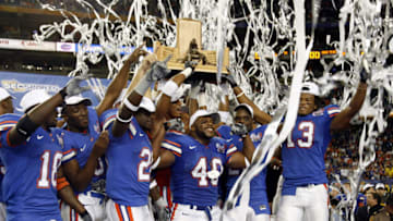 University of Florida football team celebrates their victory over Arkansas in the SEC Title game at the Georgia Dome in Atlanta, Georgia on December 2, 2006. (Photo by J. Meric/Getty Images)