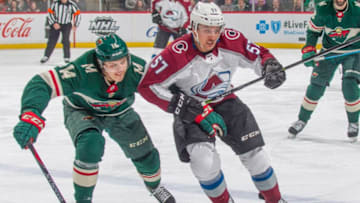 ST. PAUL, MN - MARCH 13: Joel Eriksson Ek #14 of the Minnesota Wild and Gabriel Bourque #57 of the Colorado Avalanche skates to the puck during the game at the Xcel Energy Center on March 13, 2018 in St. Paul, Minnesota. (Photo by Bruce Kluckhohn/NHLI via Getty Images)