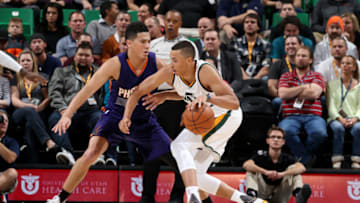 SALT LAKE CITY, UT - OCTOBER, 12: Dante Exum #11 of the Utah Jazz drives against Devin Booker #1 of the Phoenix Suns during a preseason game on October 12, 2016 at Vivint Smart Home Arena in Salt Lake City, Utah. Copyright 2016 NBAE (Photo by Melissa Majchrzak/NBAE via Getty Images)