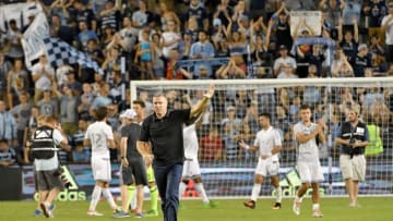Jul 10, 2016; Kansas City, KS, USA; Sporting Kansas City manager Peter Vermes walks around the field saluting and applauding the fans after the match against the New York City FC at Children