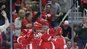 DETROIT, MI - OCTOBER 5: Anthony Mantha #39 of the Detroit Red Wings celebrates his second period goal against the Minnesota Wild with Henrik Zetterberg #40 of the Detroit Red Wings and Tomas Tatar #21 of the Detroit Red Wings at Little Caesars Arena on October 5, 2017 in Detroit, Michigan. The Red Wings defeated the Wild 4-2. (Photo by Duane Burleson/Getty Images)