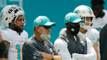 MIAMI GARDENS, FLORIDA - SEPTEMBER 20: Offensive coordinator Chan Gailey and head coach Brian Flores of the Miami Dolphins look on prior to the game between the Miami Dolphins and the Buffalo Bills at Hard Rock Stadium on September 20, 2020 in Miami Gardens, Florida. (Photo by Michael Reaves/Getty Images)