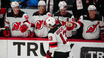 Mar 1, 2023; Denver, Colorado, USA; New Jersey Devils center Nico Hischier (13) celebrates his empty net goal with teammates in the third period against the Colorado Avalanche at Ball Arena. Mandatory Credit: Ron Chenoy-USA TODAY Sports