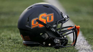 Sep 3, 2015; Mount Pleasant, MI, USA; General view of Oklahoma State Cowboys helmet on field prior to a game against Central Michigan at Kelly/Shorts Stadium. Mandatory Credit: Mike Carter-USA TODAY Sports