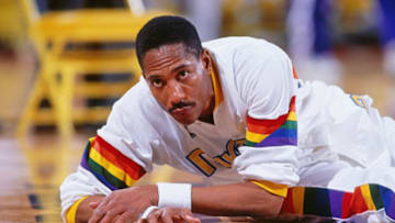 DENVER - 1990: Alex English #2 of the Denver Nuggets stretches against the Dallas Mavericks during a game played circa 1990 at McNichols Arena in Denver, Colorado. NOTE TO USER: User expressly acknowledges and agrees that, by downloading and or using this photograph, User is consenting to the terms and conditions of the Getty Images License Agreement. Mandatory Copyright Notice: Copyright 1990 NBAE (Photo by Scott Cunningham/NBAE via Getty Images)